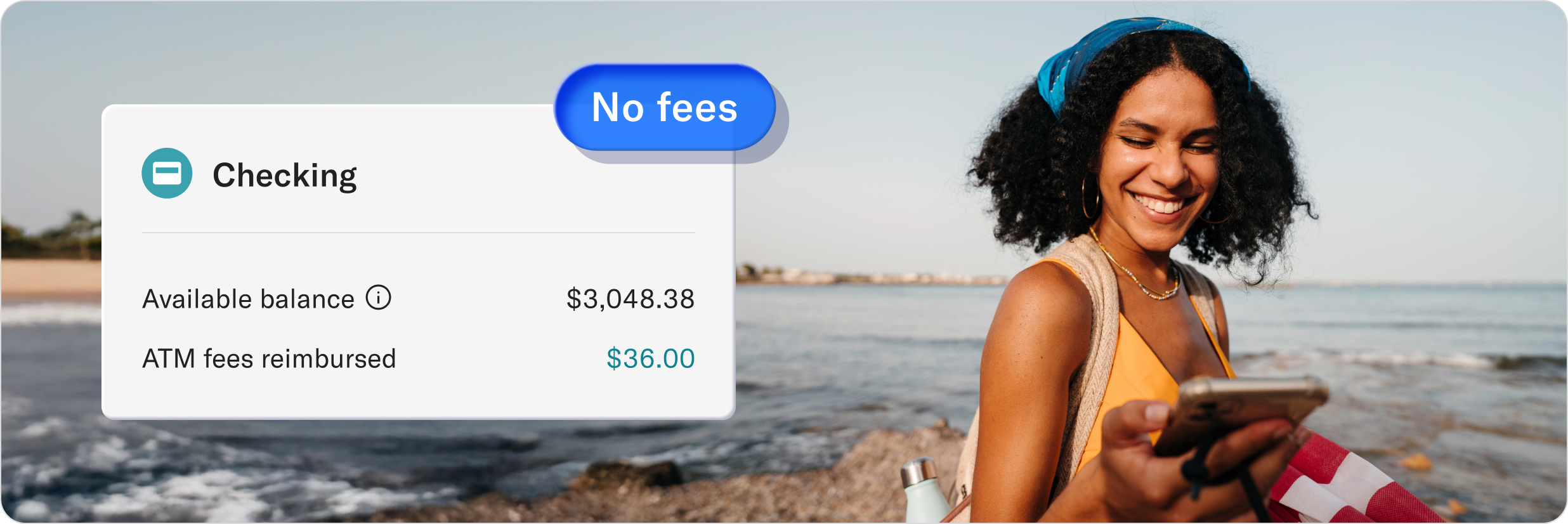 Man on a sofa smiling while using his phone